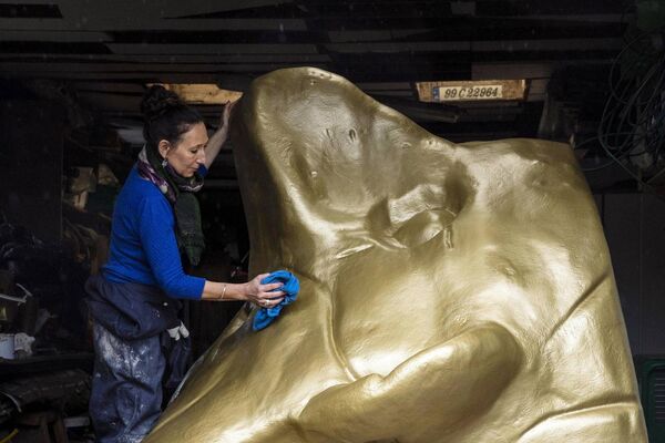 Fiona Mullholland puts the finishing touches to Face Cup, her sculpture for Princes Street, Cork. Picture: Clare Keogh