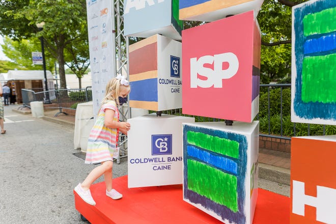 Mollie Craig, 3, plays with the movable blocks during Artisphere on Sunday, May 9, 2021.
