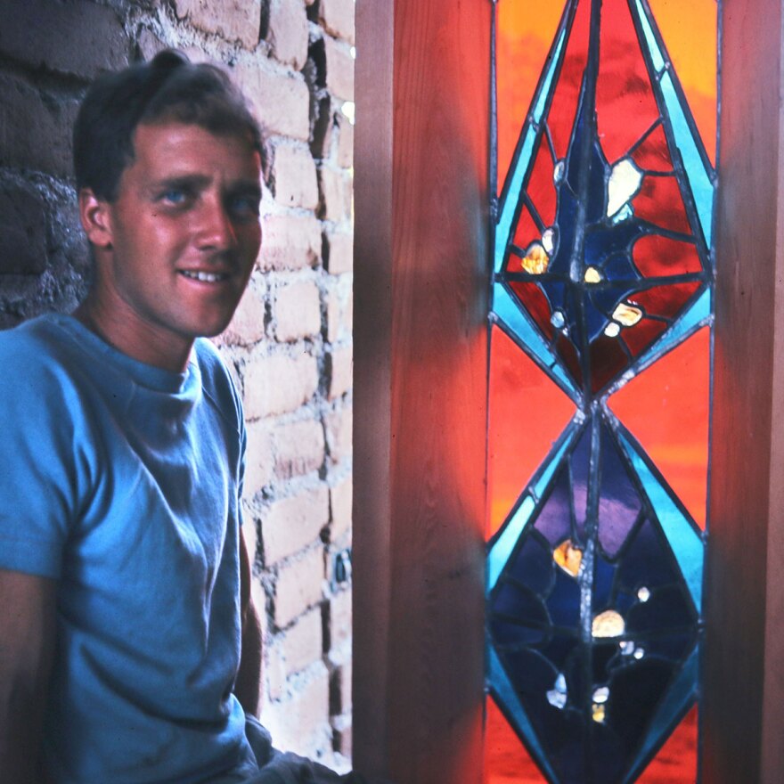 A young James Hubbell is shown with a work of stained glass in an undated photo.