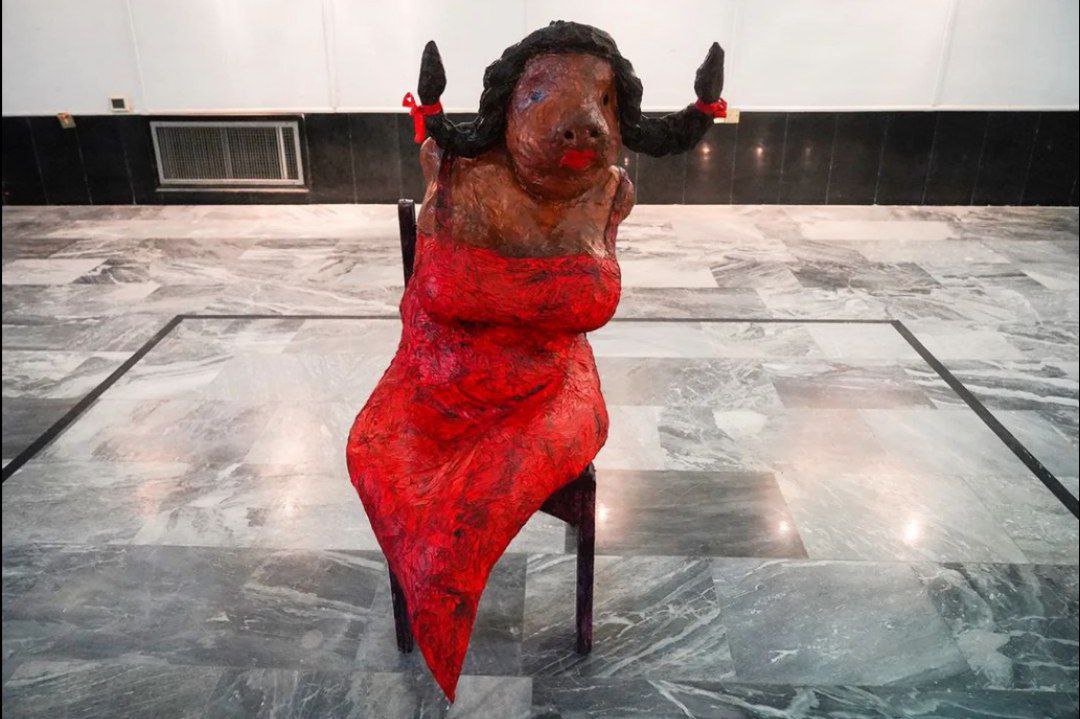 Fashionista by Luay Al-Hadhary, one of the works displayed in the exhibition where the artist featured a statue of a wbuffalo dressing a red dress.