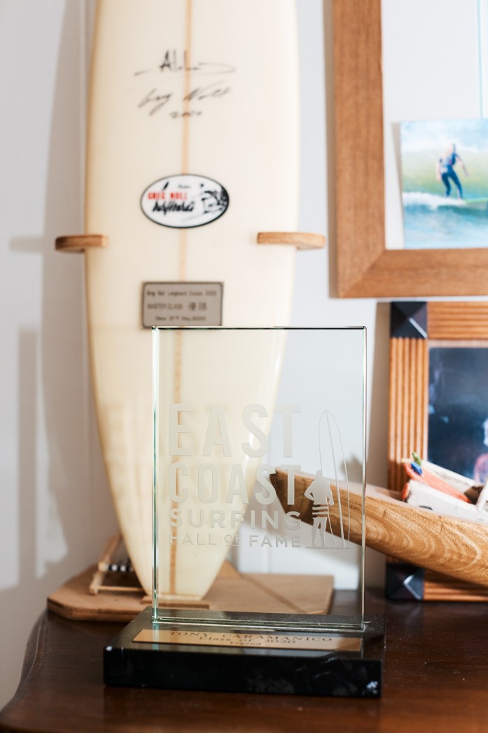 His East Coast Hall Of Fame Legends award from 2020, and his Greg Noll surfboard trophy, won in Japan in 2000