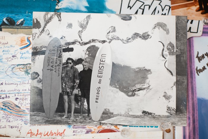 With Julian Schnabel, and boards painted by Schnabel, on Warhol’s Montauk estate in 1990