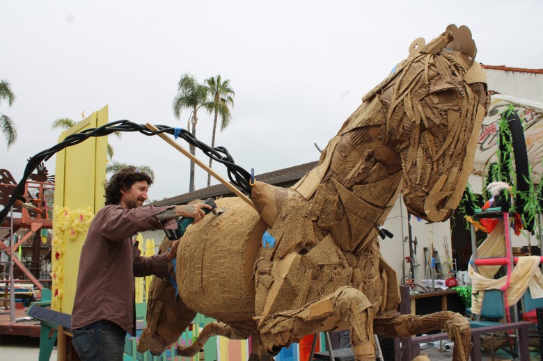 Daniel Elmer Landman works on his float for the upcoming Santa Barbara Summer Solstice Parade.