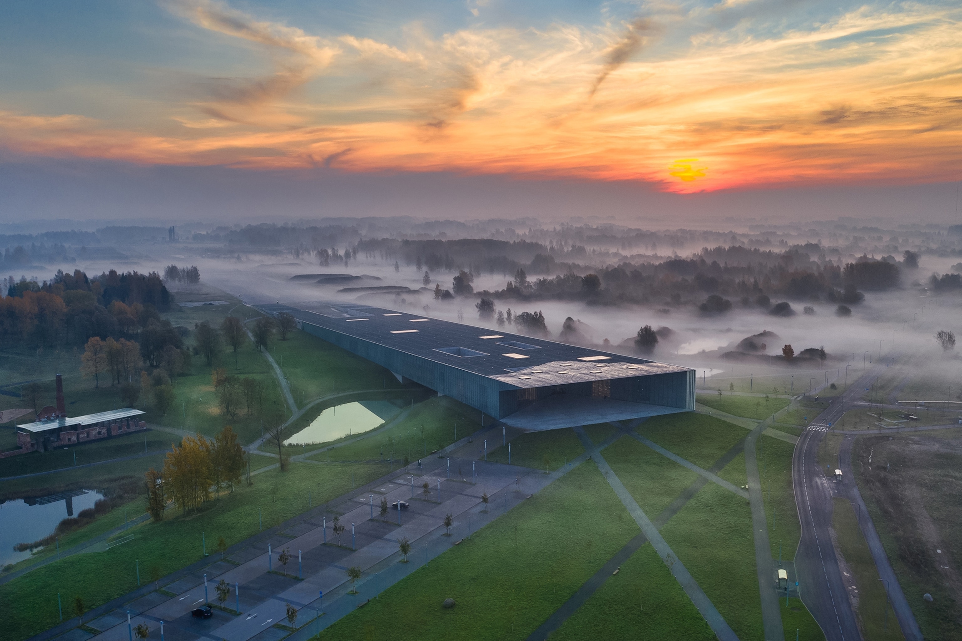 A misty fog surrounds an old aircraft hanger in Estonia