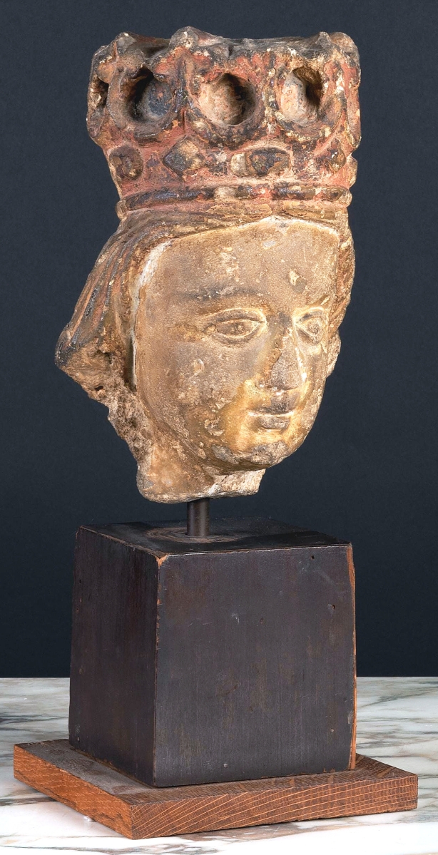 A French Gothic limestone head of a king raised on an ebonized and wood base took $6,500.