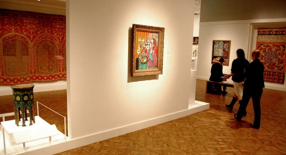 The exhibition "Matisse in the Studio" pairs the French artist's paintings with a small painted Algerian gueridon table (at left here), North African textiles and other studio props. (Greg Cook)