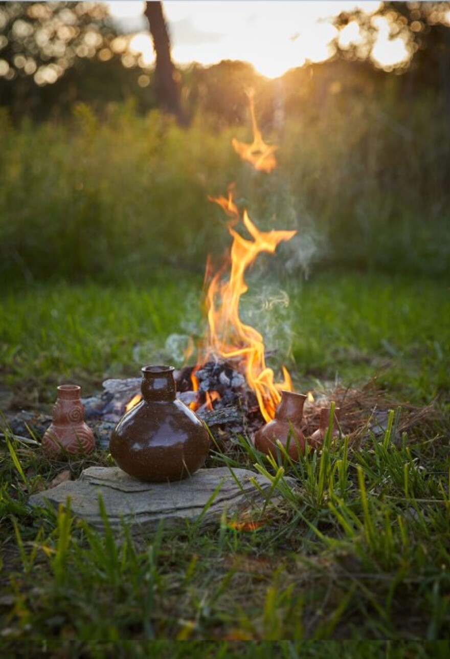 Caddo artist Chase Kahwinhut Earles creates ceramics through open ground wood fire.