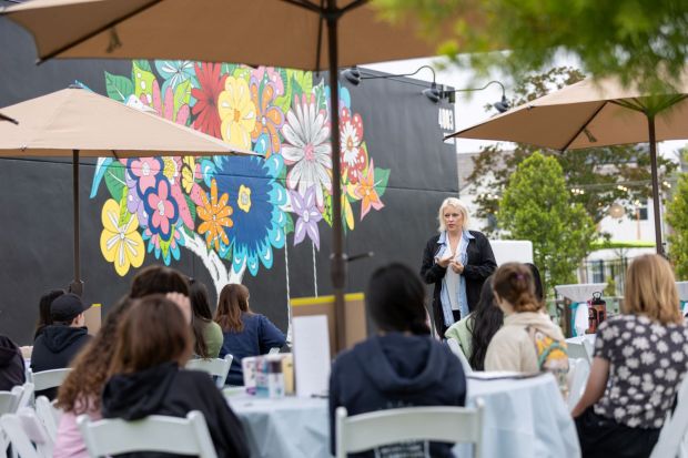 Artist Kelsey Montague speaks Friday, May 17, 2024, about her new mural at Bedford South Corona, a master-planned community in Corona. (Courtesy of Alan Silva)