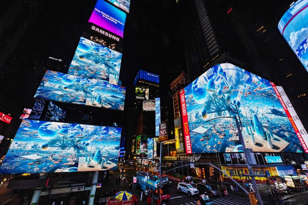 many screens show blue abstract images in times square