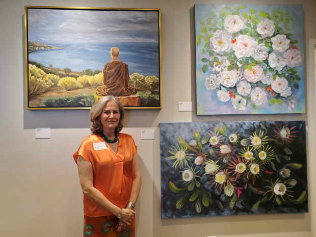 Artist Holly Given shows her large paintings on display at...