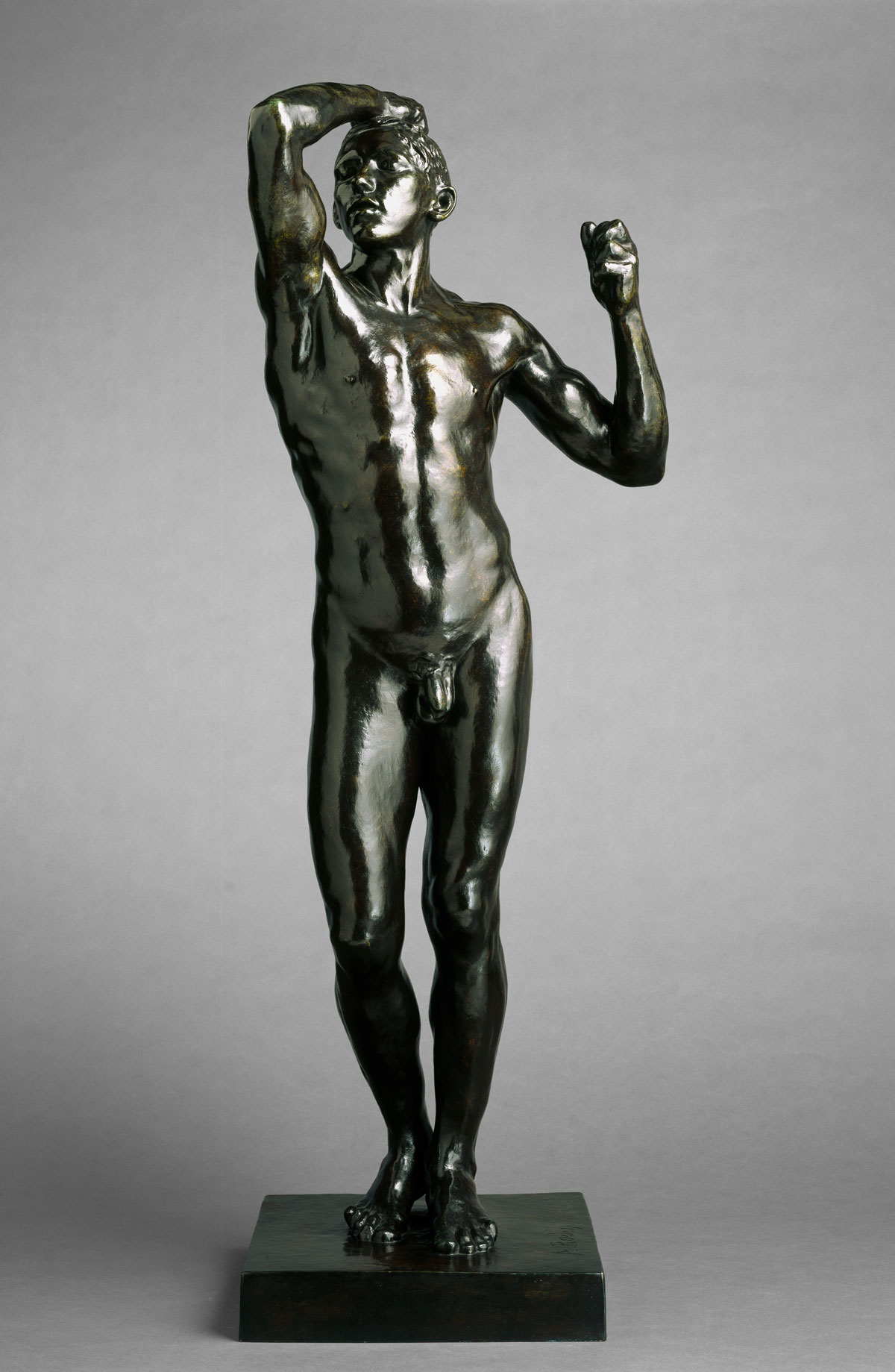 Bronze sculpture of a naked man with one arm resting on his head