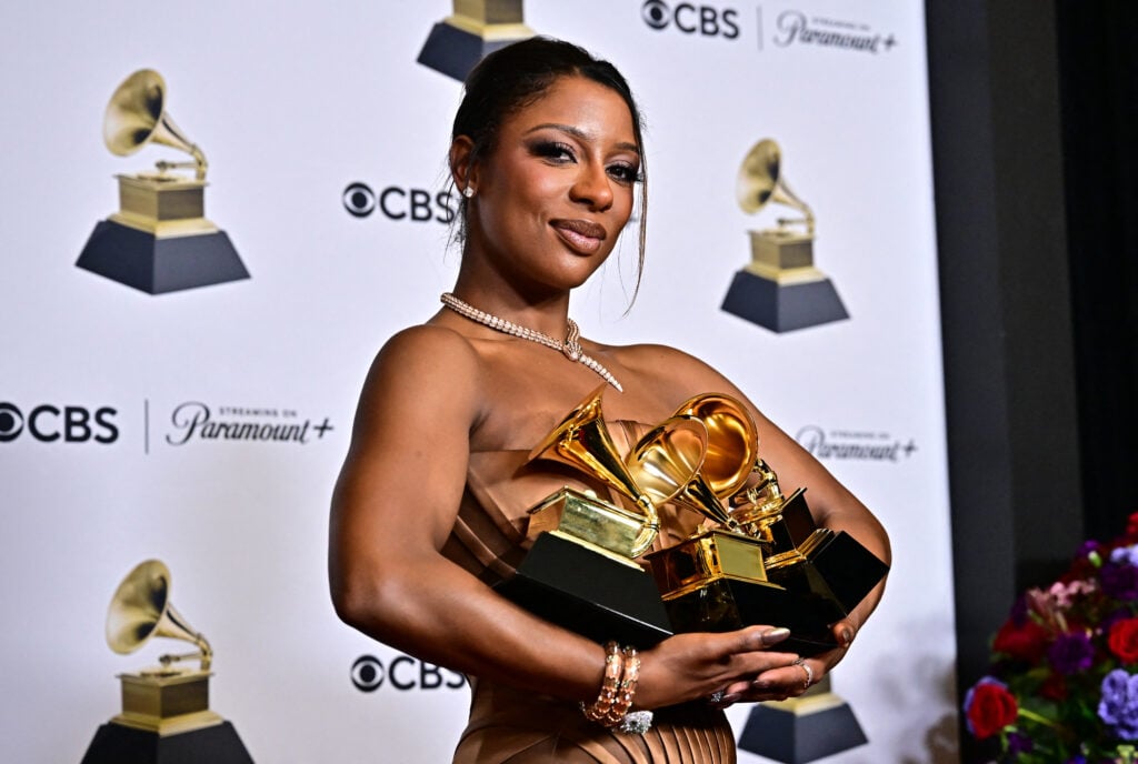 Victoria Monet in February of 2024, holding her Grammy Awards.