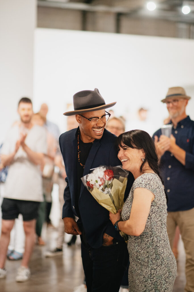 Curator Jean-Claude (J.C.) Futrell at the opening reception for "Darrell Anderson: Risk & Change" at Denver's RedLine Contemporary Art Center