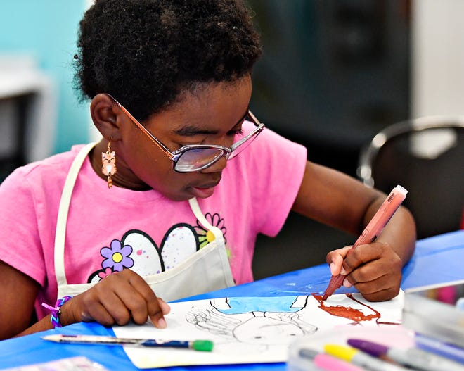 Irisa Zitrick, 7, of Mount Wolf, participates in local artist and art therapist Rosa Luz Catterall’s monthly art wellness activity for the first time, at Marketview Arts in York City, Saturday, July 6, 2024. (Dawn J. Sagert/The York Dispatch)