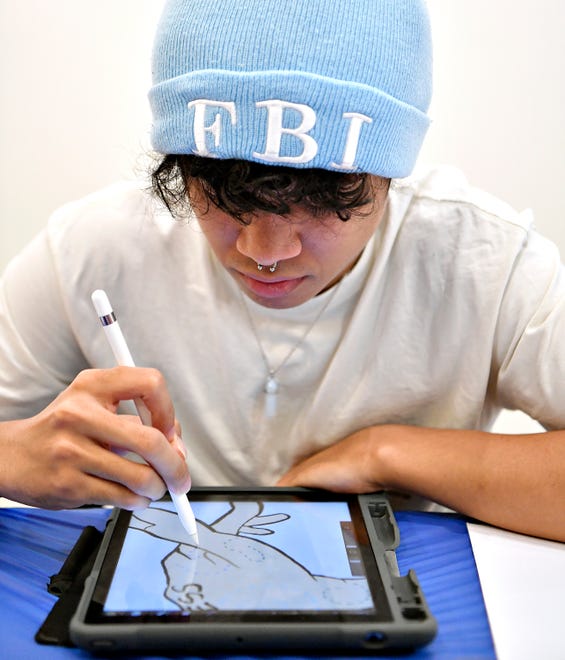 Truth Wadley, of Manchester Township, works on a piece in Procreate during local artist and art therapist Rosa Luz Catterall’s monthly art wellness activity at Marketview Arts in York City, Saturday, July 6, 2024. (Dawn J. Sagert/The York Dispatch)