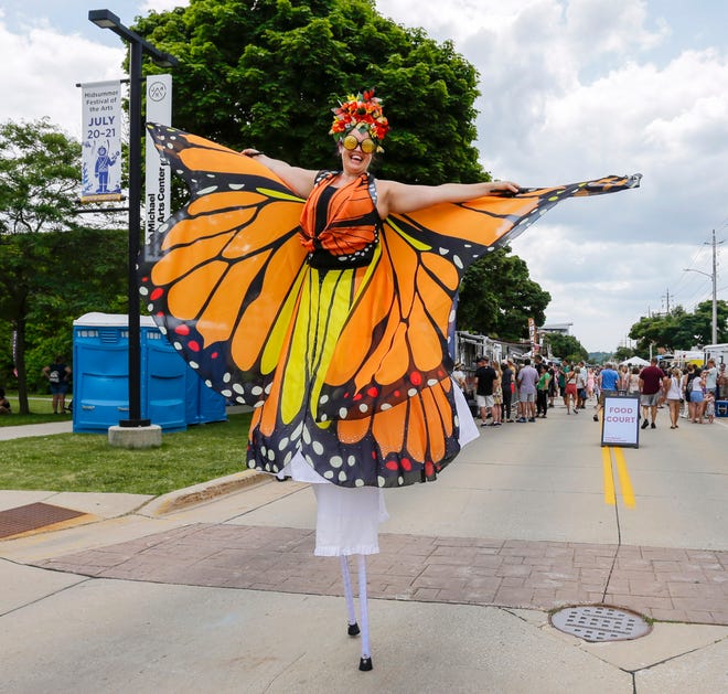 A stilt walker spreads her “wings” during the John Michael Kohler Arts Center’s Midsummer Festival of the Arts, Saturday, July 20, 2024, in Sheboygan, Wis.