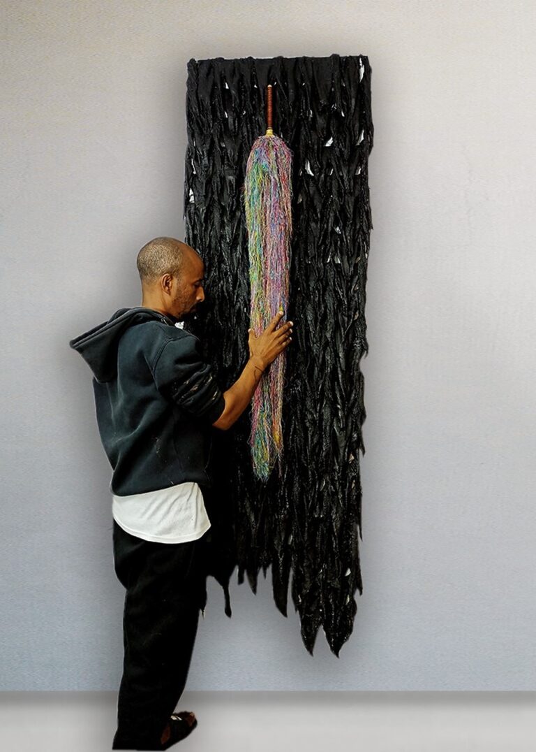 Moshe Tarka with one of his works. Photo courtesy of Moshe Tarka