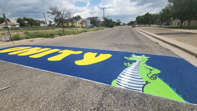 A creative crosswalk designed by Deandre Jones just finished Thursday outside Carver Elementary School in Amarillo.