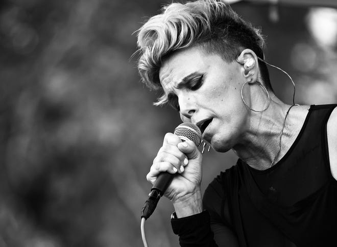 Musical artist Bonne Finken sings during the Waukee Arts Festival on Friday, July 19. The two-day event at Centennial Park featured local artists and music.