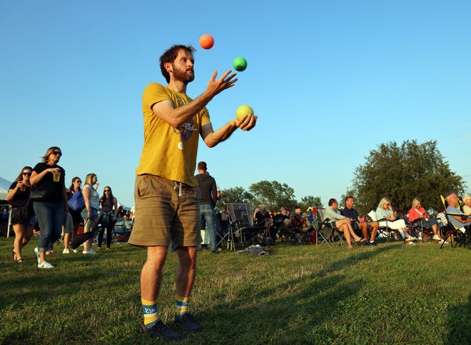 A juggler performs during the Waukee Arts Festival on Saturday, July 20. The two-day festival at Centennial Park featured local artists and live music.