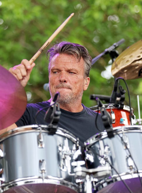 Russ Tomlinson plays the drums in the Bonne Finken band during the Waukee Arts Festival on Friday, July 19. The two-day festival at Centennial Park featured local artists and live music.