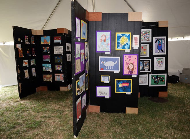 The student art exhibit is on display at the Waukee Arts Festival on Friday, July 19. The two-day festival at Centennial Park featured local artists and live music.