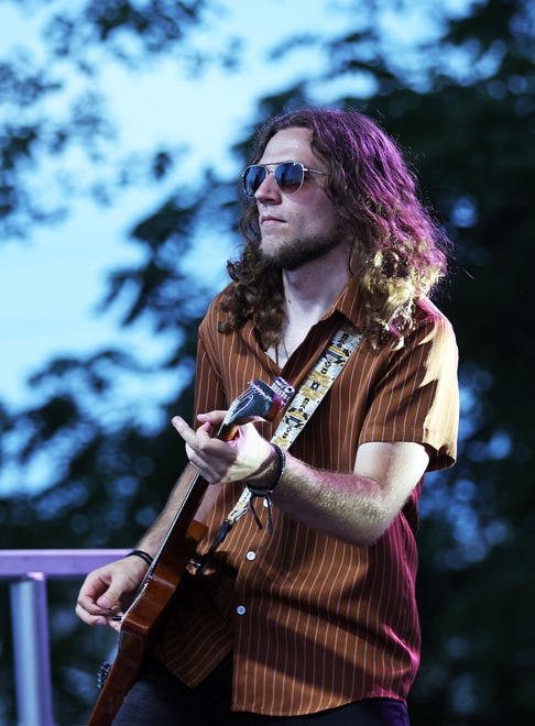 The Not Quite Brothers band performs classic rock at the Waukee Arts Festival on Friday, July 19. The two-day festival at Centennial Park featured local artists and live music.