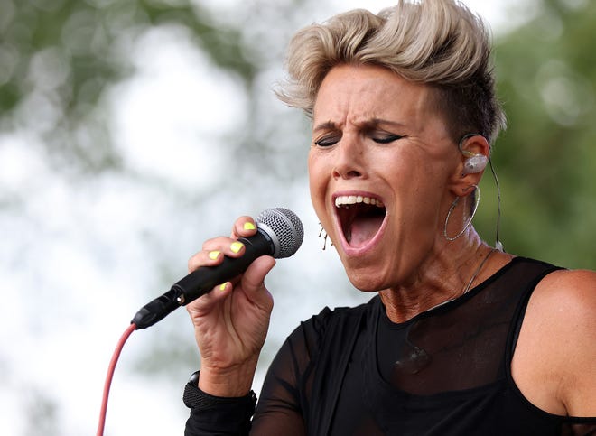 Musical artist Bonne Finken sings during the Waukee Arts Festival on Friday, July 19. The two-day festival at Centennial Park featured local artists and live music.