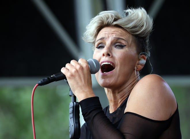 Musical artist Bonne Finken sings during the Waukee Arts Festival on Friday, July 19. The two-day festival at Centennial Park featured local artists and live music.