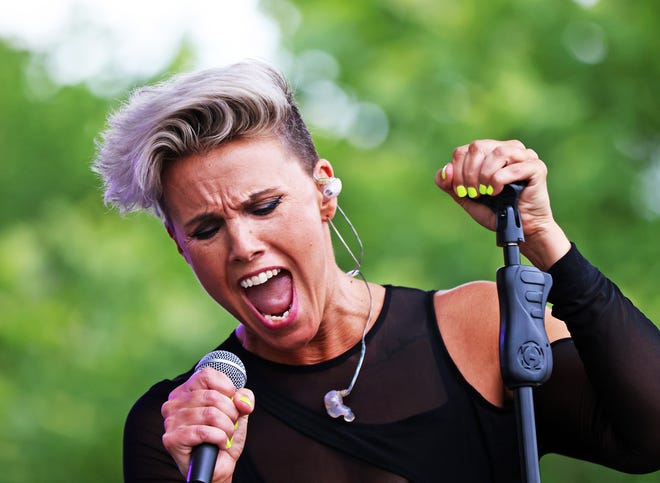 Musical artist Bonne Finken sings during the Waukee Arts Festival on Friday, July 19. The two-day festival at Centennial Park featured local artists and live music.