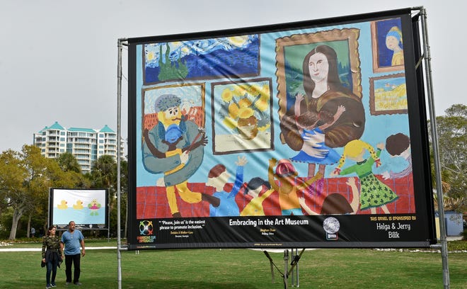 "Embracing in the Art Museum" was one of the 50 billboard-sized posters that was matched with a quotation and featured in the 2024 exhibition of Embracing our Differences at Sarasota's Bayfront Park.