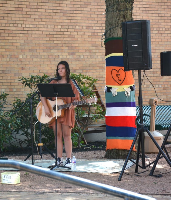 Layla Weaver performed in Trinity Park around lunchtime Sunday during the Chalk the Block.