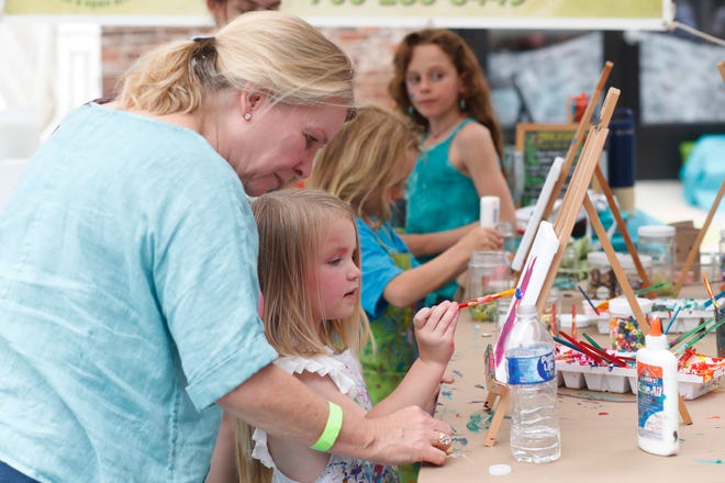 Kids paint at FoxSaid Festival at the Cotton Press in Athens, Ga., on Saturday, July 27, 2024. The art and music festival featured interactive art with a number of local artists and raised money for art education in local schools.