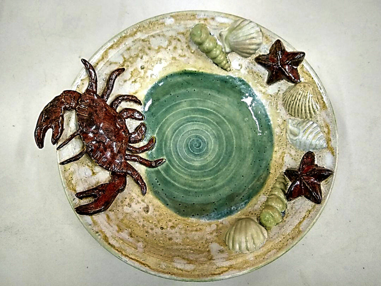 Janet Piccolas By The Sea demonstrates her use of Sgraffito.