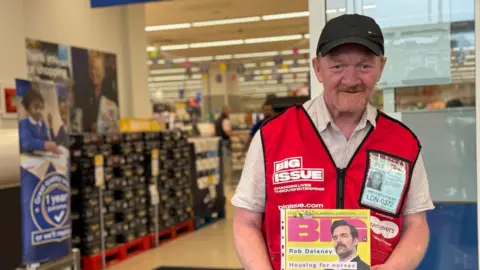 Homewards  Dave Martin selling a Big Issue