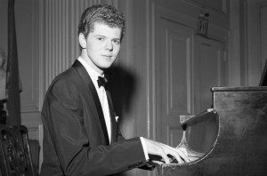 Van Cliburn sits at the keyboard during a dinner in his honor at the Lotos Club on Oct. 1, 1958 in New York, NY.