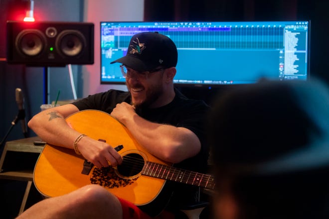 Music Producer, Ned Cameron, laughs with Chase Wright and Jacob Hackworth Cameron’s studio in Madison, Tenn., Thursday, July 11, 2024.