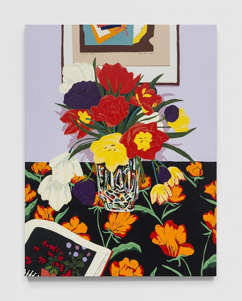 A contemporary intimist painting featuring a crystal vase of variously colored tulips on a tablecloth with an orange tulip pattern, all against a lavender painted wall where the bottom half of a framed print is visible. The corner of an open book is in the bottom left with a picture of tulips shown.