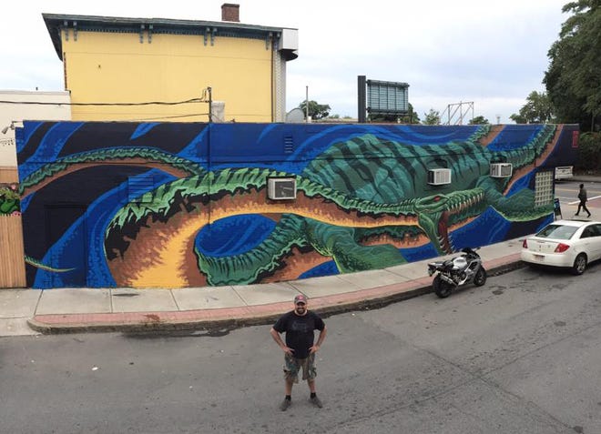 Scott Boilard shared a photo of "Plesiosaur," a mural he painted at Green and Temple Streets, depicting a plesiosaurus, an extinct, water-dwelling creature. Boilard painted the mural as part of the POW! WOW! mural festival.