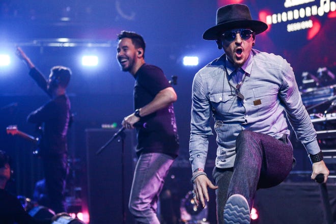 (L-R) Brad Delson, Mike Shinoda and Chester Bennington of Linkin Park perform on stage at the iHeartRadio Album Release Party presented by State Farm at the iHeartRadio Theater Los Angeles on May 22, 2017 in Burbank, California.