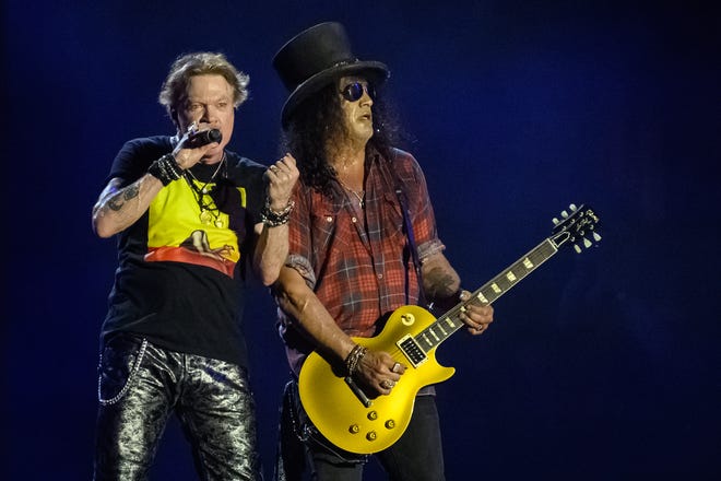 Axl Rose (L) and Slash of Guns 'n' Roses perform on the Pyramid Stage on Day 4 of Glastonbury Festival 2023 on June 24, 2023 in Glastonbury, England.