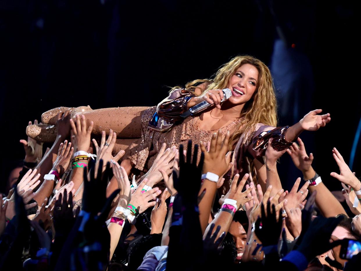 Shakira crowd-surfs during her VMAs performance in 2023.