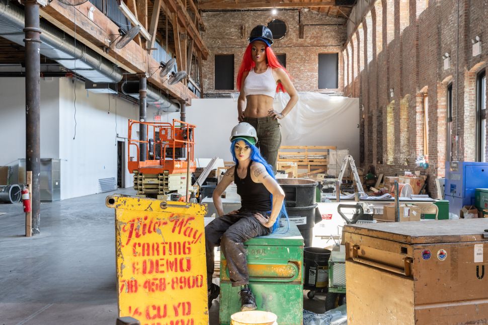 Image of two people dressed as construction workers.