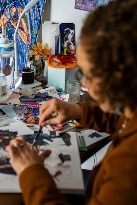 Artist Mary Mindiola works on a new piece of artwork Friday, July 5, 2024, at her studio in Indianapolis. Mindiola creates detailed work made from cut magazine paper after a trip to the Cayman Islands, where she found a large amount of single-use plastic along the beach shoreline.