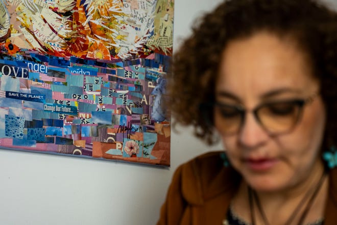 Artist Mary Mindiola works on a new piece of artwork Friday, July 5, 2024, at her studio in Indianapolis. Mindiola creates detailed work made from cut magazine paper after a trip to the Cayman Islands, where she found a large amount of single-use plastic along the beach shoreline.