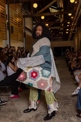 A model swishes a quilted, colorful coat.