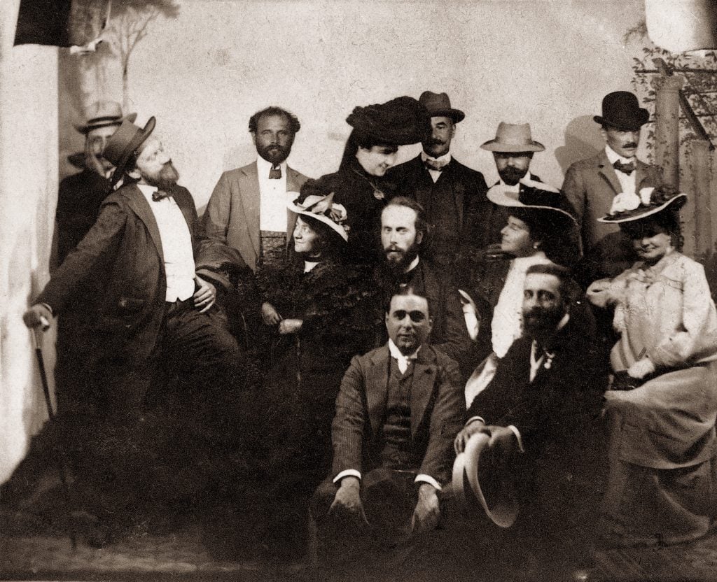 Black and white photograph of a group of men and women