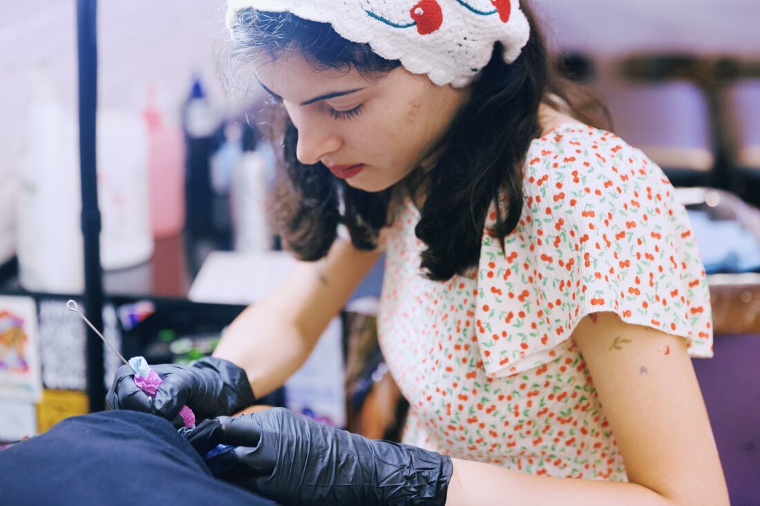 Abby Ingwersen, a guest artist at Nice Try Tattoo, works on a client.