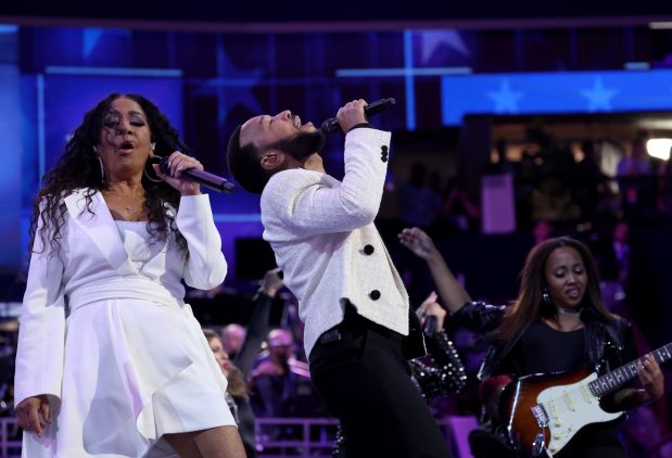 Singers John Legend and Sheila E. perform at the Democratic National Convention at the United Center in Chicago on Aug. 21, 2024.(Brian Cassella/Chicago Tribune)